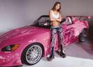 A image of Devon Aoki with a car