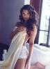 Ali Landry covering herself in a white sheet