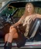 Ali Larter in a car