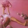 Alicia Silverstone lied on the floor playing with a puppy