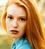 Alicia Witt in blonde hair and blue collars