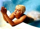 Alyssa Milano swimming in the pool