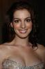 Anne Hathaway elegant in a beige dress