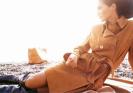 Astrid Munoz in overcoat