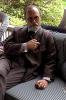 Billy Crystal Sitting On Sofa