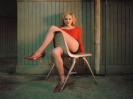 Brittany Murphy in red on a chair