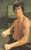 Bruce Lee wearing black pants