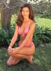 Charisma Carpenter in pink swimsuit