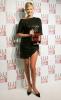 Charlize Theron holding a style award