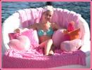 Chelsea Staub on a pink bed