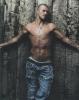 David Beckham posing on wall