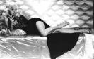 Diana Dors posing on bed