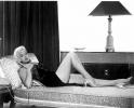 Diana Dors posing with telephone