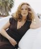 Elizabeth Perkins on a chair
