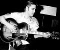 Elvis Presley playing guitar