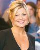 Emily Symons smiling with hair tied up