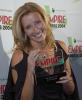 Emma Thompson holding the award