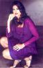 Gabriela Posing in a Purple Dress