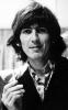 George Harrison Enjoying His Ciggarete