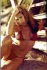 Hot red babe Daisy Fuentes