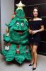 Jan Anderson Standing in Black With the Christmas Tree