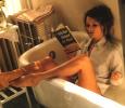 Kate Moss Reading in the Bath Tub