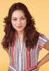 Mila Kunis Infront of Yellow Background