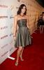 Summer Altice in a grey dress